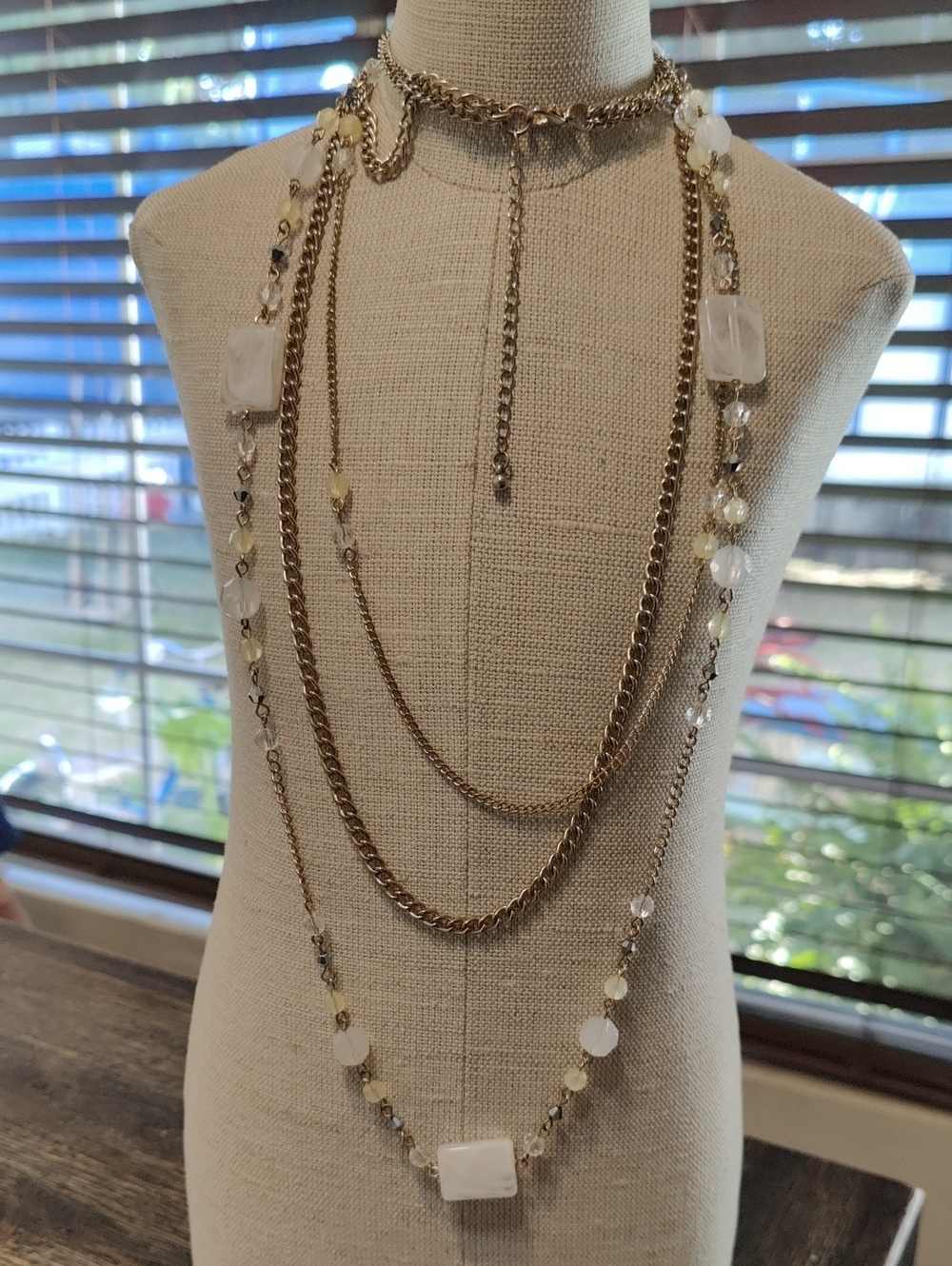Gold Multi-Strand Necklace with White Bead Accents